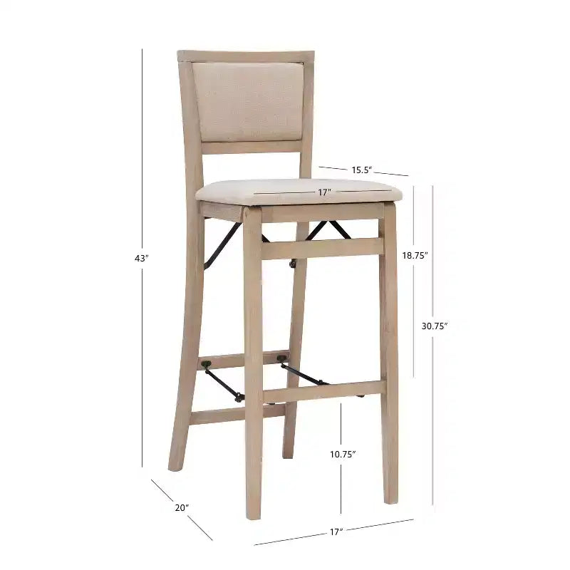 Sgabello pieghevole da bar Keira con schienale imbottito e seduta rivestita in legno massello lavato grigio - Linon