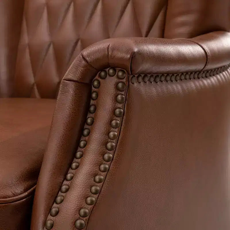 Poltrona Valerius in vera pelle con finiture borchiate e gambe in legno massello | HULALA HOME