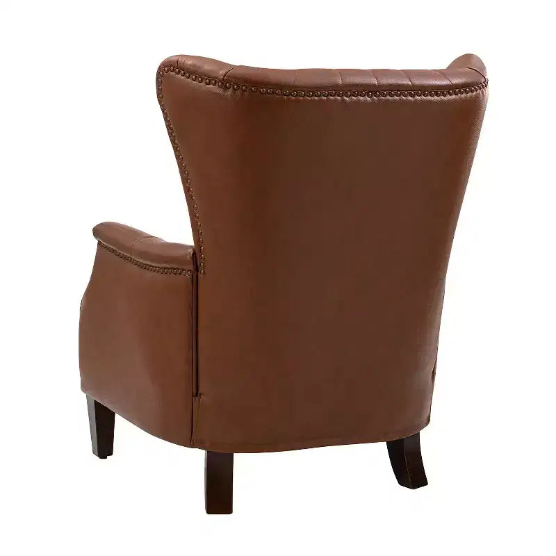 Poltrona Valerius in vera pelle con finiture borchiate e gambe in legno massello | HULALA HOME