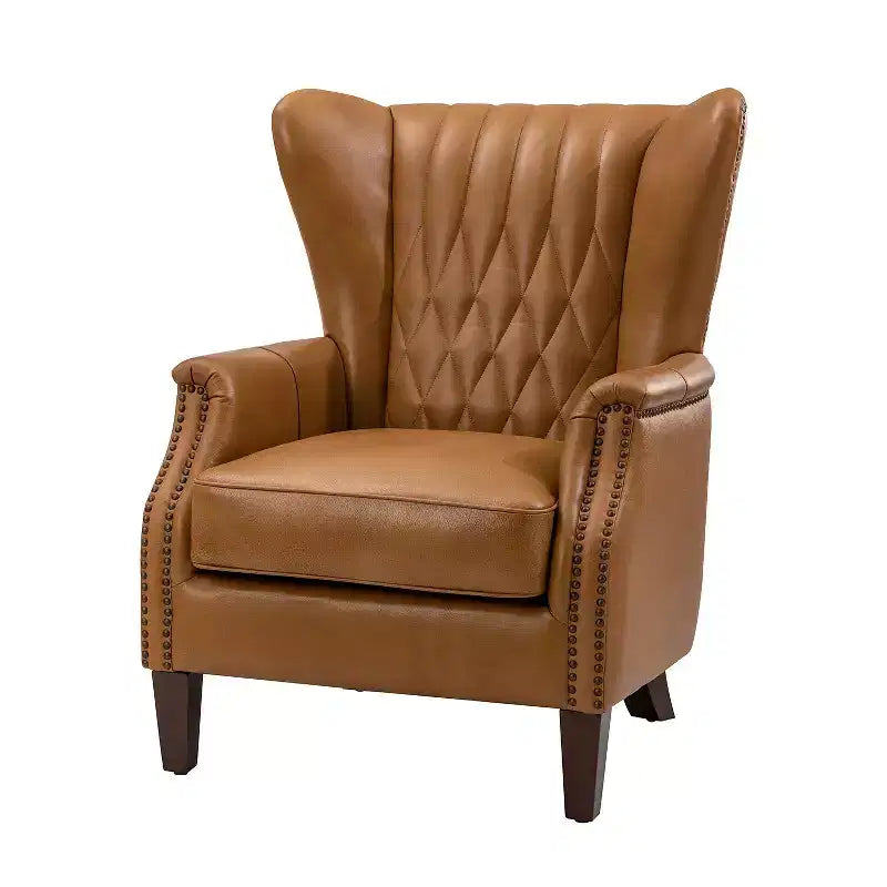 Poltrona Valerius in vera pelle con finiture borchiate e gambe in legno massello | HULALA HOME