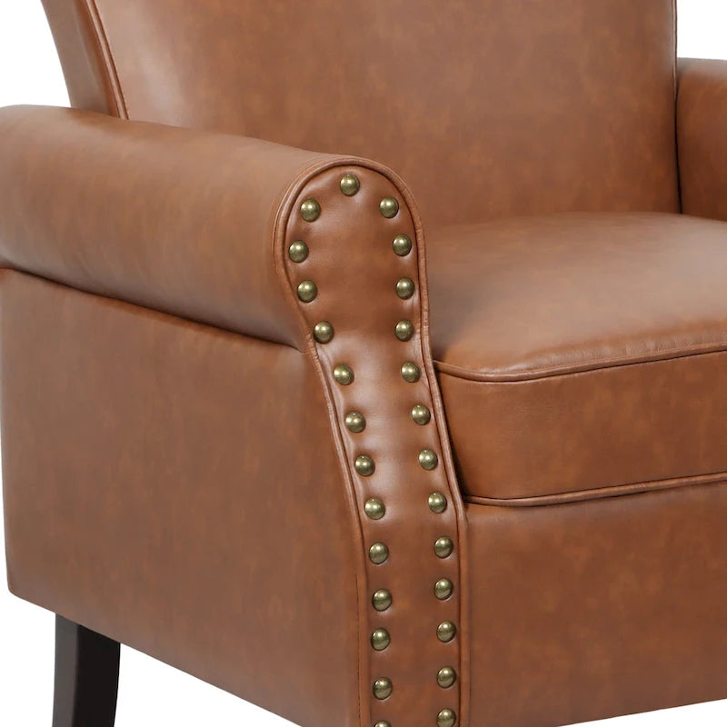 Poltroncina in PU con braccioli arrotolati e finiture borchiate