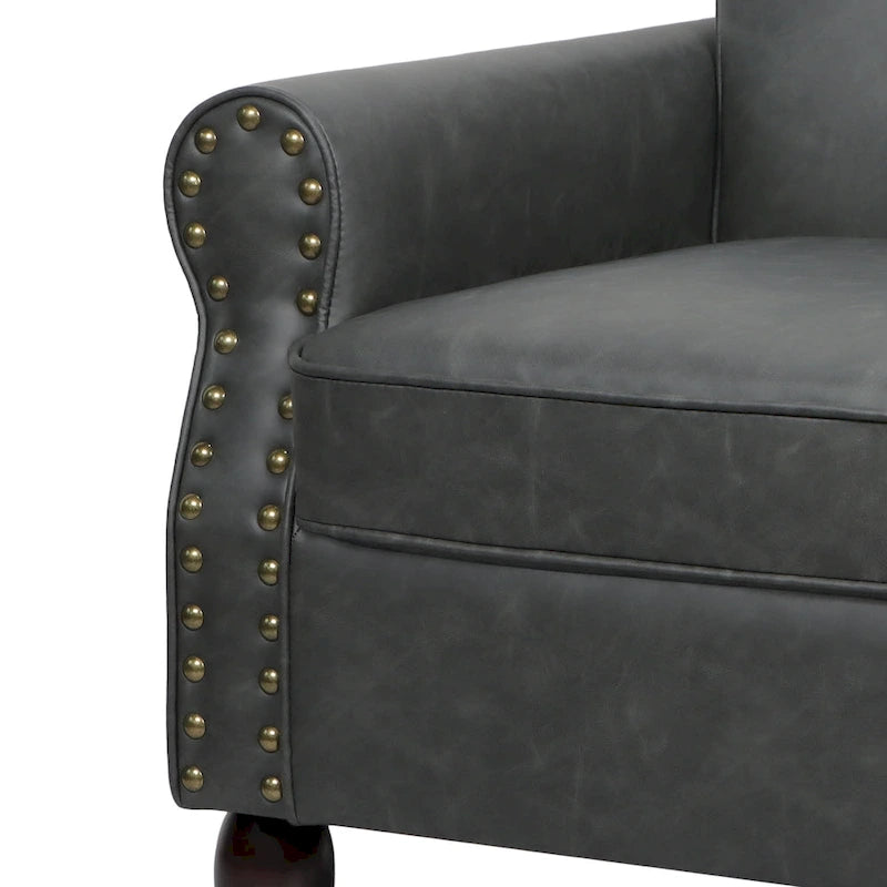 Poltroncina in PU con braccioli arrotolati e finiture borchiate