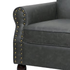 Poltroncina in PU con braccioli arrotolati e finiture borchiate
